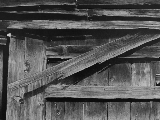 Graphite drawing of the weathered wooden planks from the exterior of the historic Sonora, CA Gold Country Mississippi House barn door